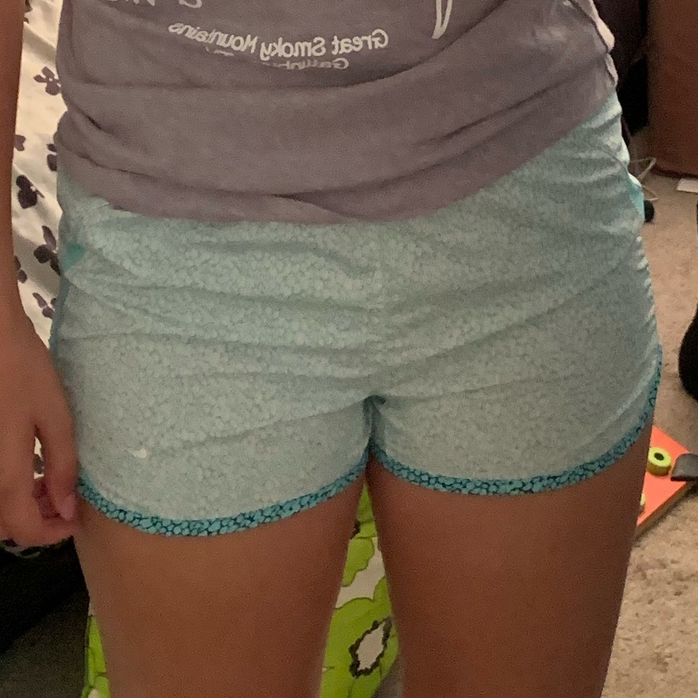 Size x small white and teal Nike running shorts
